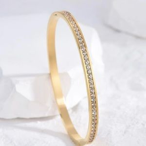 Gold and rhinestone bracelet.